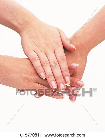 Three people piling hands View Large Photo Image Stock Image - Three people piling hands. Fotosearch