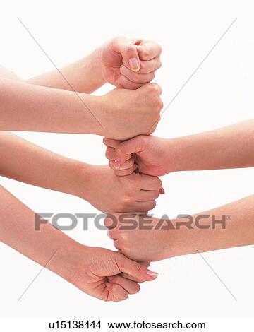 Three people piling up fists View Large Photo Image Picture - Three people piling up fists. Fotosearch