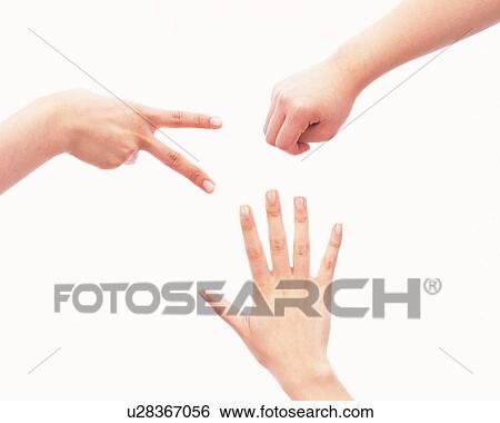 Three people playing rock-scissors-paper View Large Photo Image Stock Photograph - Three people playing rock-scissors-paper. Fotosearch