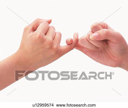 Two women twisting pinkies of each other View Large Photo Image Picture - Two women twisting pinkies of each other. Fotosearch