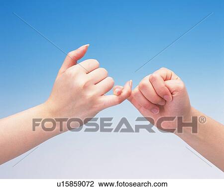 Two women twisting pinkies of each other View Large Photo Image Stock Image - Two women twisting pinkies of each other. Fotosearch