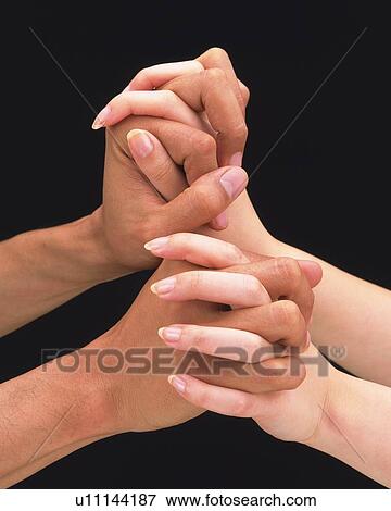 Stock Photo - Woman and man folding hands of each other. Fotosearch