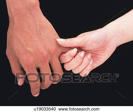 Woman clasping pinkie of man View Large Photo Image Stock Image - Woman clasping pinkie of man. Fotosearch