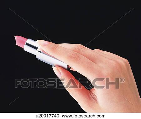 Woman holding a lipstick View Large Photo Image Stock Image - Woman holding a lipstick. Fotosearch