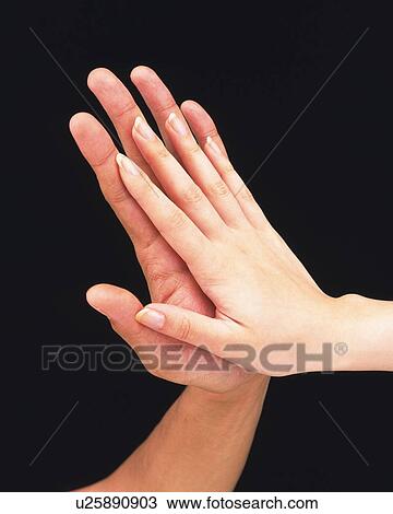 Woman laying her hand on man's hand View Large Photo Image Stock Image - Woman laying her hand on man's hand . Fotosearch