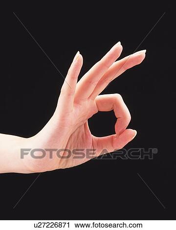 Woman making a circle with thumb and forefinger View Large Photo Image Stock Image - Woman making a circle with thumb and forefinger. Fotosearch