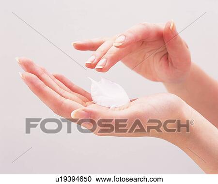Woman putting foam on palm View Large Photo Image Stock Image - Woman putting foam on palm. Fotosearch