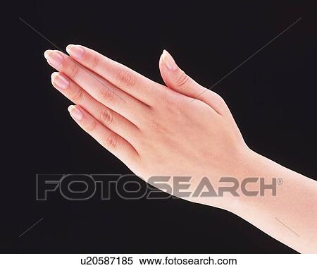 Stock Photography - Woman's hand, black background. Fotosearch