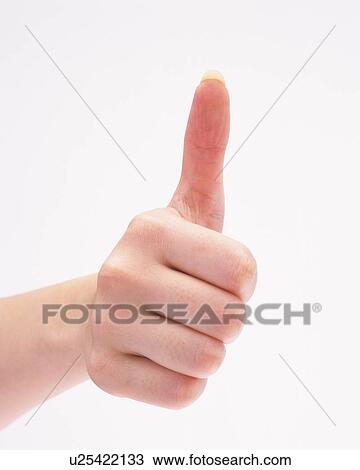 Stock Image - Woman's hand giving thumbs up sign. Fotosearch