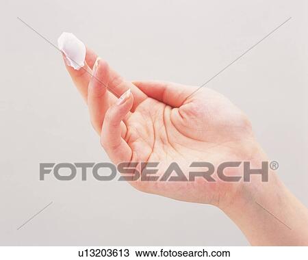Woman's hand with cream on middle finger View Large Photo Image Stock Image - Woman's hand with cream on middle finger. Fotosearch