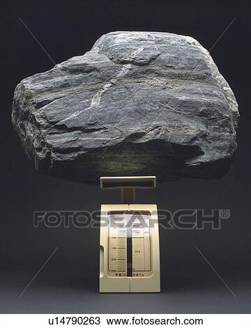 Stock Image - A rock on the scale. Fotosearch