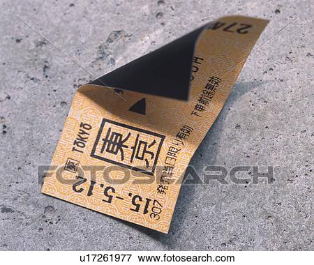 Stock Photo - Bent train ticket on marble floor. Fotosearch