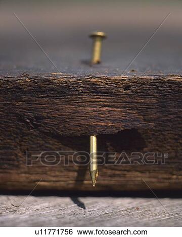 Stock Photograph - Close up of nailed wooden board. Fotosearch