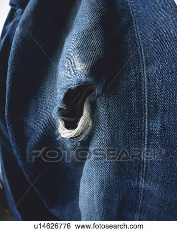 Close up of ripped jeans View Large Photo Image Stock Photo - Close up of ripped jeans. Fotosearch
