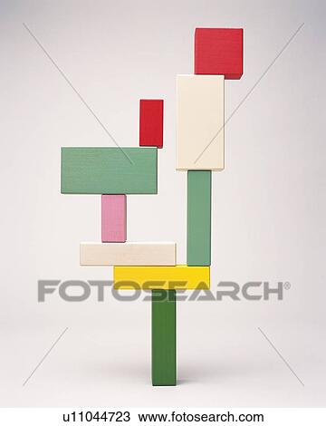Stock Image - Colored blocks unstably piled up. Fotosearch