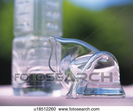 Crooked glass and plastic bottle View Large Photo Image Stock Image - Crooked glass and plastic bottle. Fotosearch