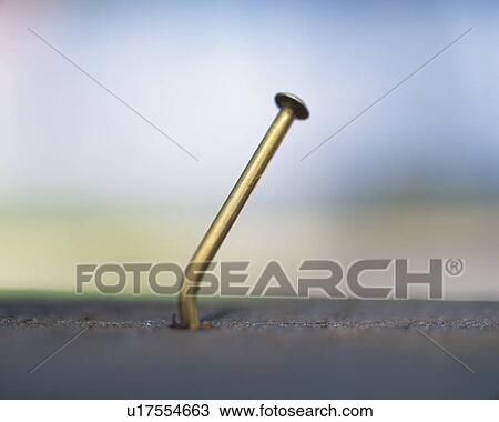 Crooked nail poking out to air View Large Photo Image Stock Image - Crooked nail poking out to air. Fotosearch