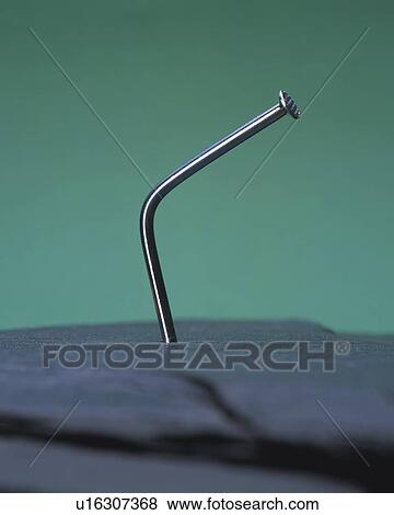 Crooked nail poking out to air View Large Photo Image Stock Photo - Crooked nail poking out to air. Fotosearch