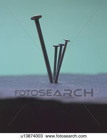 Stock Image - Four nails poking out to air. Fotosearch