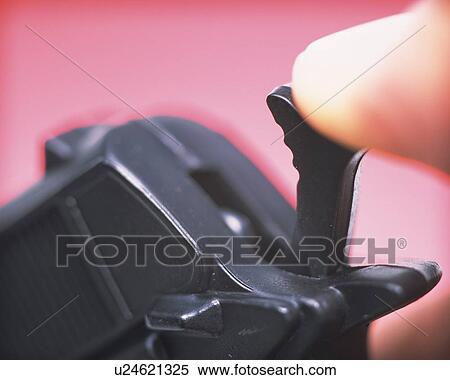 Stock Photography - Human finger putting on trigger of a gun . Fotosearch