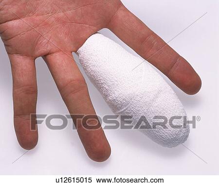 Stock Photography - Human hand bandaged middle finger. Fotosearch