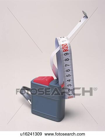 Stock Photo - Measuring tapes getting entangled each other . Fotosearch