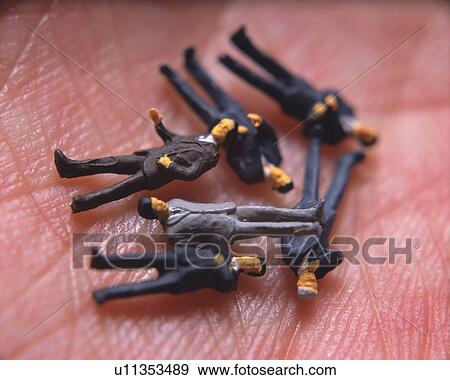 Toy figurines of men on human hand View Large Photo Image Stock Photo - Toy figurines of men on human hand. Fotosearch