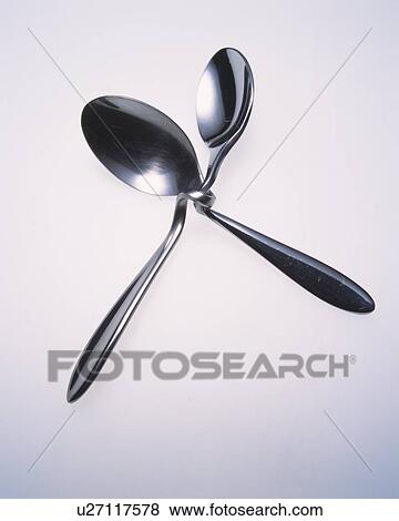 Stock Photo - Two twisted spoons. Fotosearch