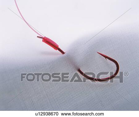 Stock Image - White fabric being put on a hook . Fotosearch