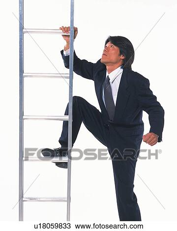Stock Image - Image of a Businessman About to Get on a Metallic Ladder, Looking Up, Side View. Fotosearch