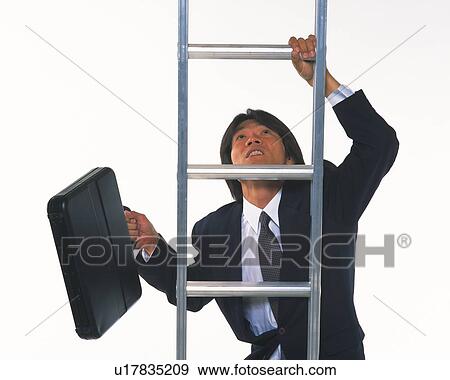 Image of a Businessman Climbing Up a Metallic Ladder With a Briefcase in his Hand, Front View View Large Photo Image Stock Photo - Image of a Businessman Climbing Up a Metallic Ladder With a Briefcase in his Hand, Front View. Fotosearch
