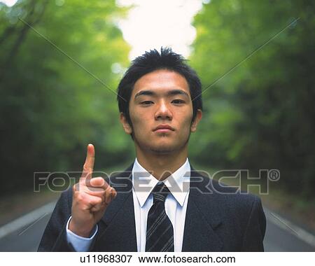 Image of a Businessman Surrounded By Trees, Pointing Up his Finger, Looking at Camera, Front View, Differential Focus View Large Photo Image Stock Photo - Image of a Businessman Surrounded By Trees, Pointing Up his Finger, Looking at Camera, Front View, Differential Focus. Fotosearch