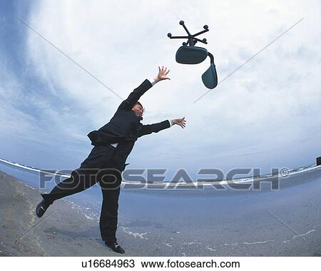 Image of a Businessman Throwing an Office Chair in the Air, Low Angle View, Fish Eye View Large Photo Image Stock Image - Image of a Businessman Throwing an Office Chair in the Air, Low Angle View, Fish Eye. Fotosearch