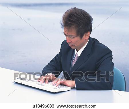 Image of a Businessman Typing Something on a Keyboard at the Beach, Side View View Large Photo Image Stock Image - Image of a Businessman Typing Something on a Keyboard at the Beach, Side View. Fotosearch