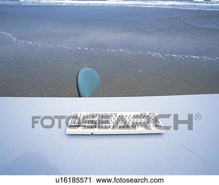 Image of a Computer Keyboard and a Part of an Office Chair at the Beach, High Angle View View Large Photo Image Stock Image - Image of a Computer Keyboard and a Part of an Office Chair at the Beach, High Angle View. Fotosearch