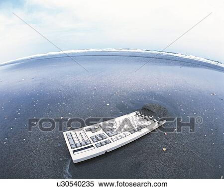 Image of a Computer Keyboard, Partly Covered in Some Wet Sand at the Beach, High Angle View, Fish Eye, Copy Space View Large Photo Image Stock Photography - Image of a Computer Keyboard, Partly Covered in Some Wet Sand at the Beach, High Angle View, Fish Eye, Copy Space. Fotosearch
