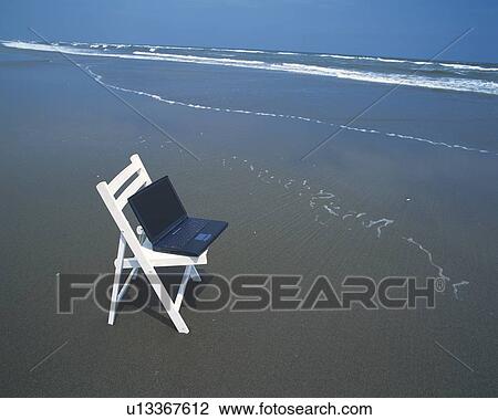 Image of a Laptop on a Wooden Chair at the Beach, High Angle View View Large Photo Image Stock Image - Image of a Laptop on a Wooden Chair at the Beach, High Angle View. Fotosearch