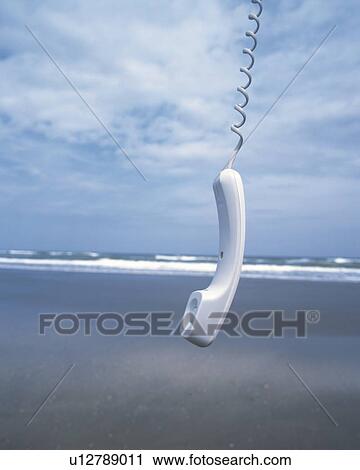 Image of a White-colored Phone Receiver Hanging at the Beach, Front View View Large Photo Image Stock Image - Image of a White-colored Phone Receiver Hanging at the Beach, Front View. Fotosearch