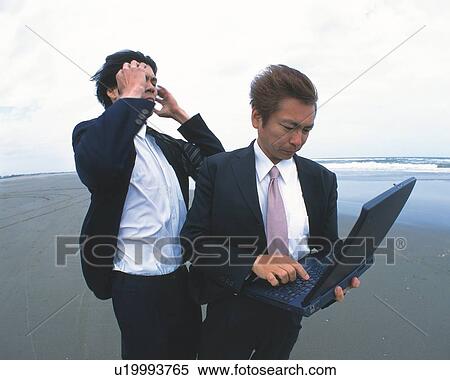 Image of Two Businessman at the Beach, One Holding a Laptop, Side View View Large Photo Image Stock Photography - Image of Two Businessman at the Beach, One Holding a Laptop, Side View. Fotosearch