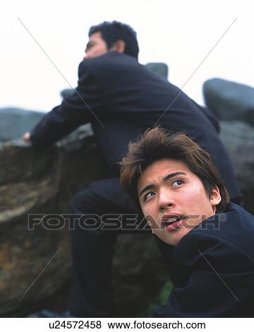 Image of Two Businessmen Climbing Rocks, Side View, Differential Focus View Large Photo Image Stock Photo - Image of Two Businessmen Climbing Rocks, Side View, Differential Focus. Fotosearch