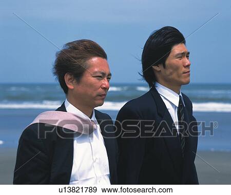 Image of Two Businessmen Walking Along the Beach, the Wind in Their Hair, Side View, Differential Focus View Large Photo Image Stock Photo - Image of Two Businessmen Walking Along the Beach, the Wind in Their Hair, Side View, Differential Focus. Fotosearch