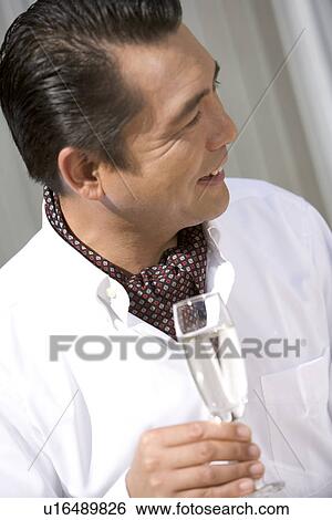 Mature Adult Man Drinking a Champagne View Large Photo Image Stock Photograph - Mature Adult Man Drinking a Champagne. Fotosearch