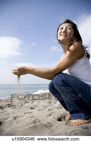 Mature Adult Woman Playing with Sand View Large Photo Image Stock Photograph - Mature Adult Woman Playing with Sand. Fotosearch