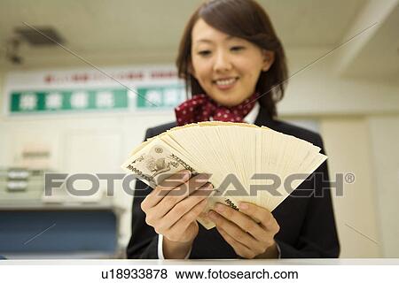 Stock Photo - Businesswoman Counting a money. Fotosearch