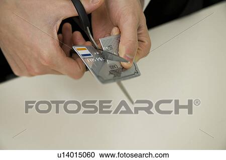 Stock Image - Cutting a Card. Fotosearch