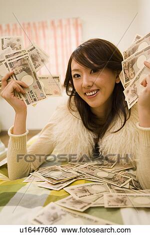 Young Adult Woman and Money View Large Photo Image Stock Image - Young Adult Woman and Money. Fotosearch