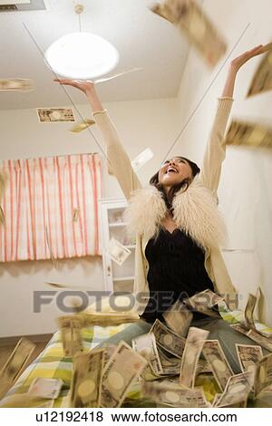Stock Photo - Young Adult Woman and Money. Fotosearch