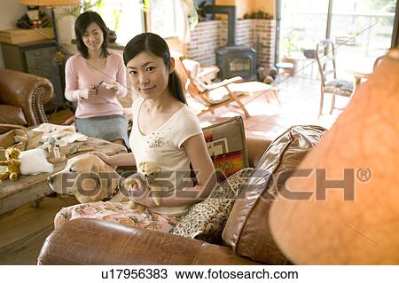 Stock Image - Mid Adult Woman and a Dog. Fotosearch
