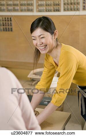 Stock Photo - Mid Adult Woman Smiling. Fotosearch