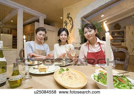 Three Mid Adult Women Eating a Meal View Large Photo Image Stock Photo - Three Mid Adult Women Eating a Meal. Fotosearch